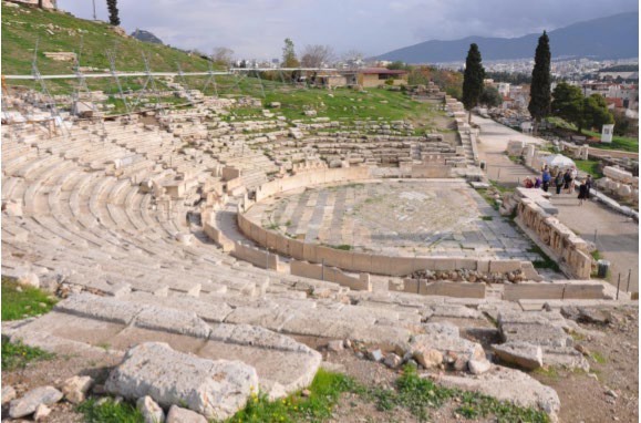 A side view of a theater with the orchestra cut in half by the Romans.