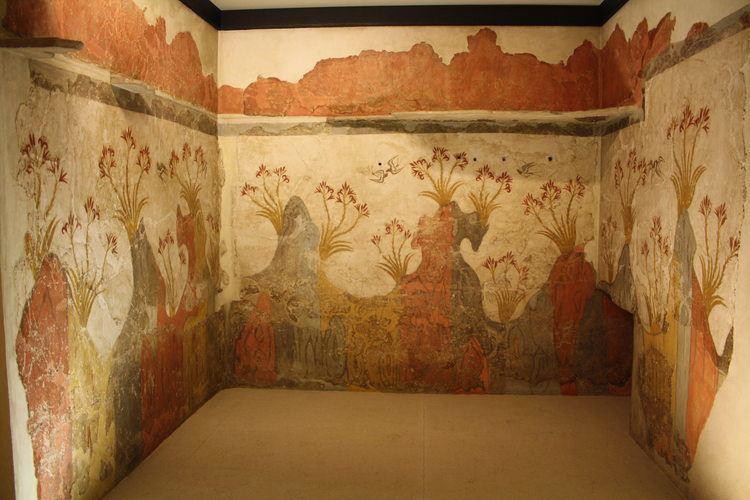 A painting that covers three adjacent walls with stylized greenery and flowers.