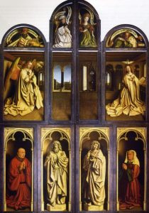 An altar piece painted in many colors. Color is used to distinguish between a figure painted to appear like a human and another painted to resemble a statue.