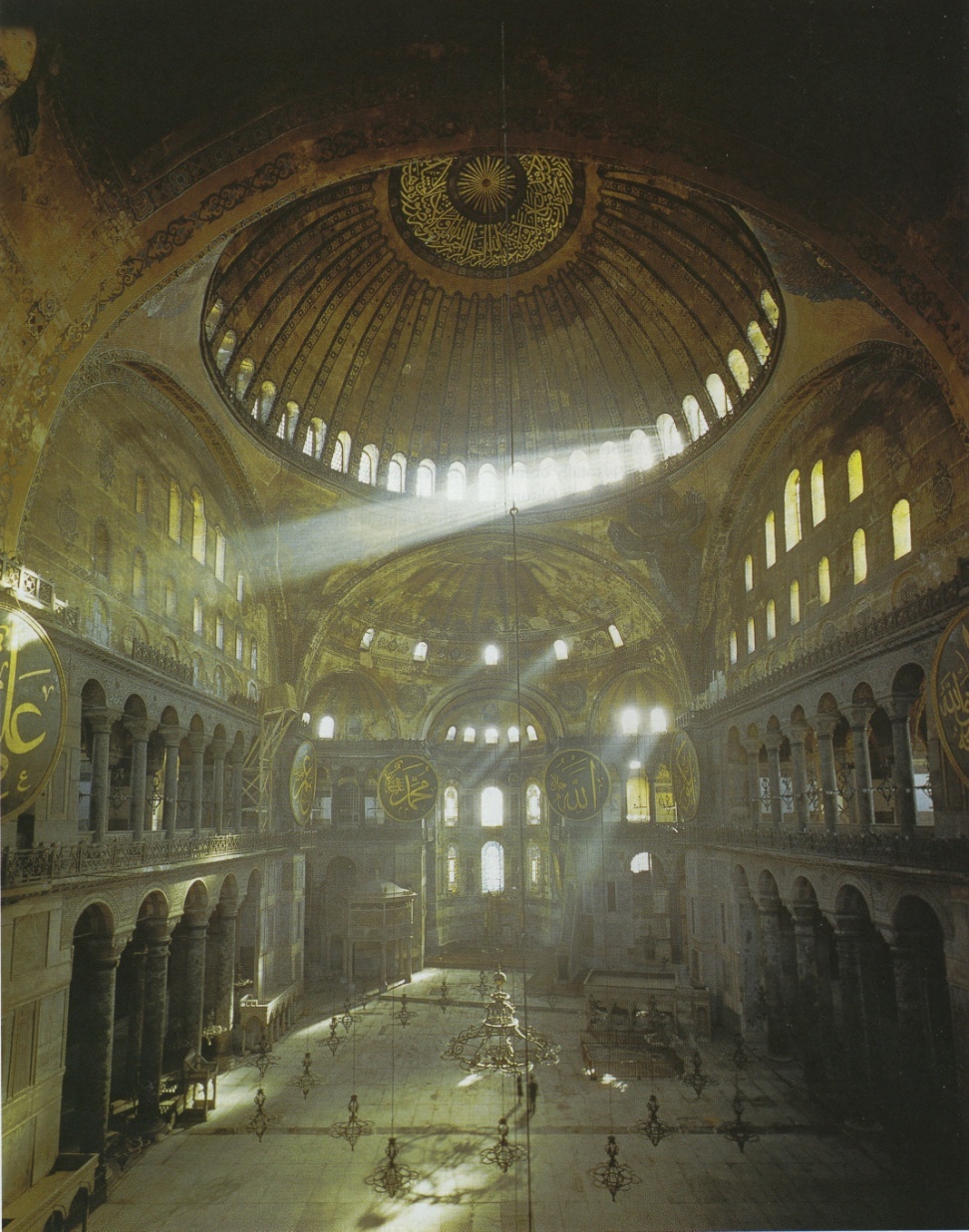 A mystical looking view of the interior flooded with light through the many windows.