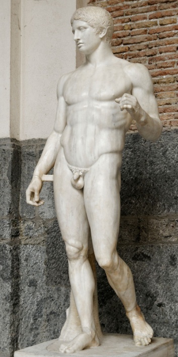 A statue of an ideally proportioned, nude man. He would have once been leaning on a spear.