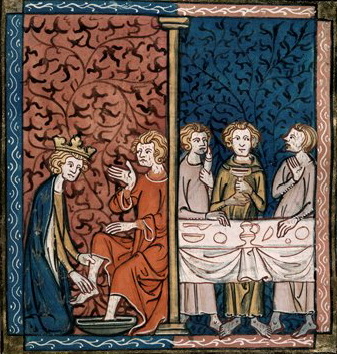 An illustration of a man getting his feet washed while others eat at a table.