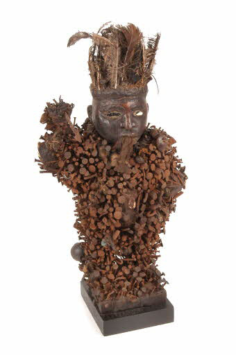 This Kongo sculpture from the Democratic Republic of Congo is wooden, but feathers, nails and other metal bits, cloth, a mirror, resin, a horn, shell, and seeds add to the work’s complex textures. Courtesy Quai Branly, 73.1968.7.2.