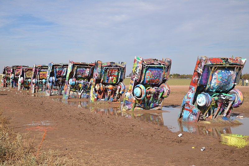 Photograph, Cadillac Ranch, 1974 colorfully painted Cadillacs sticking out of the mud.
