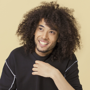 Luis, an African American man with longer curly hair