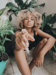 An African American young woman putting to the reader